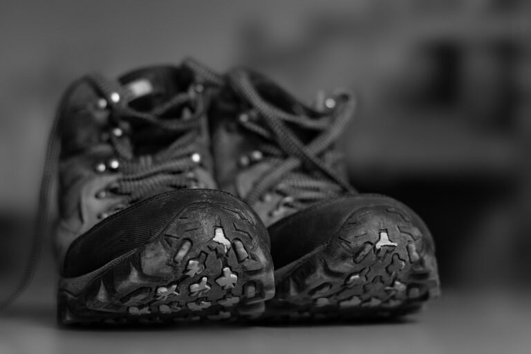 grayscale photo of black and white sneakers