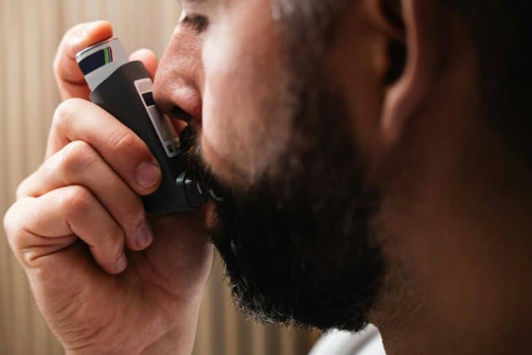 A man holding a cell phone to his ear